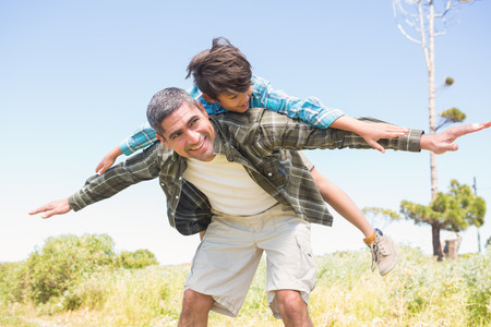 Father and son in the countryside on a sunny dayの写真素材