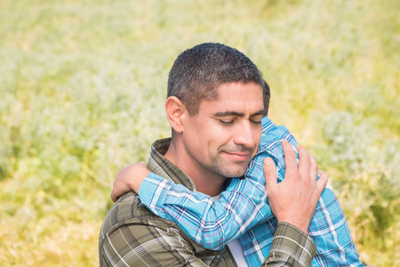 Father and son in the countryside on a sunny dayの写真素材