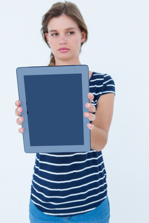 Woman showing tablet pc on white backgroundの写真素材