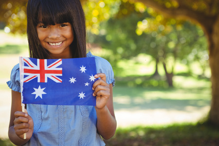 Cute little girl with australian flag on a sunny dayの写真素材