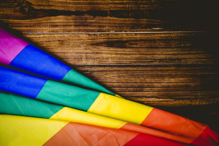 Gay pride flag on wooden table shot in studioの写真素材