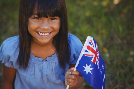 Cute little girl with australian flag on a sunny dayの写真素材