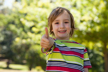 Happy little boy in the park on a sunny day