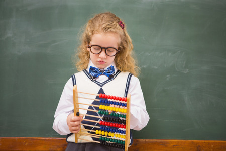 Pupil holding abacus at elementary schoolの写真素材