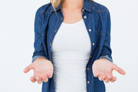 Woman presenting her hands on white backgroundの写真素材