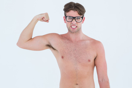 Geeky hipster posing topless on white backgroundの写真素材