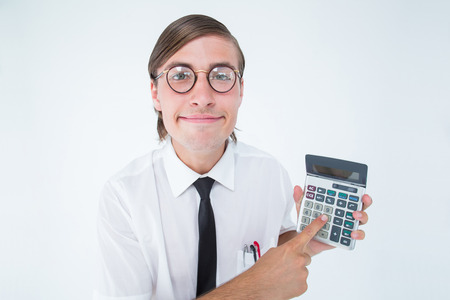 Geeky smiling businessman showing calculator on white backgroundの写真素材