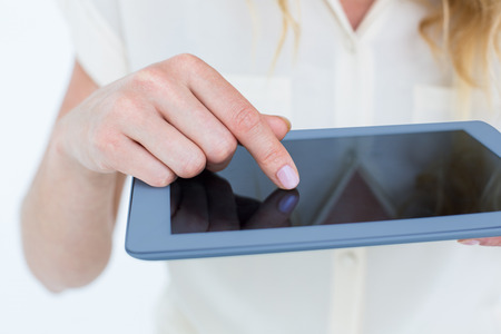 Woman using tablet pc on white backgroundの写真素材