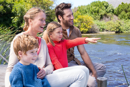 Happy family at a lake in the countrysideの写真素材