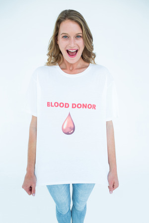 Smiling blood donor on white backgroundの写真素材
