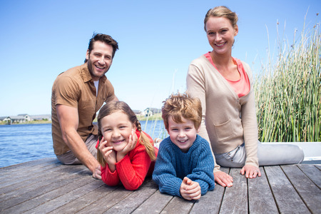 Happy family at a lake in the countrysideの写真素材