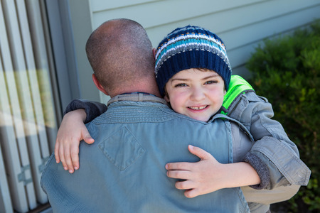 Father and son hugging in the countrysideの写真素材