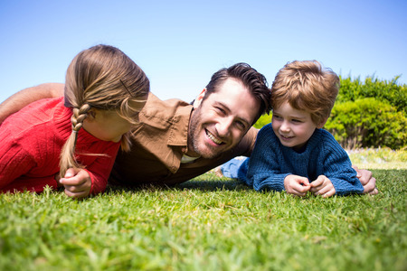 Happy father with his children in the countrysideの写真素材