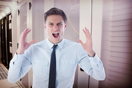 Angry businessman shouting against data center