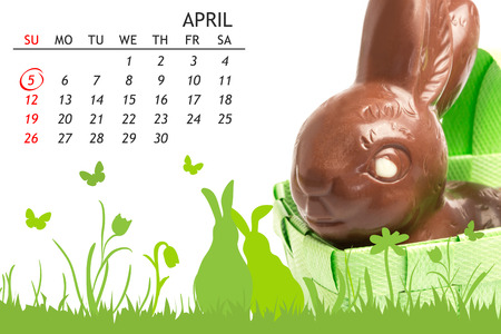 red circle against chocolate bunny in a basketの写真素材