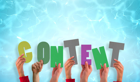 hands showing content against blue pool under bright lightの写真素材