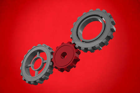 Cogs and wheels against red backgroundの写真素材