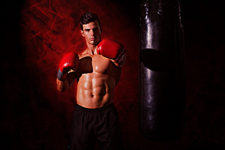 Muscular boxer against dark backgroundの写真素材