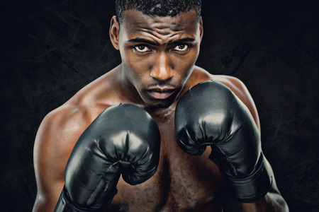 Muscular boxer against dark backgroundの写真素材