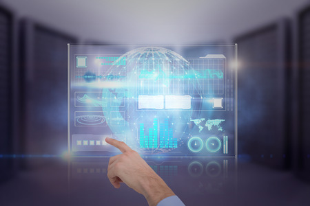Hand of a businessman pointing something against glowing sphere on black background