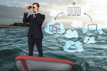 Businessman in boat with binoculars against stormy sea with lighthouseの写真素材