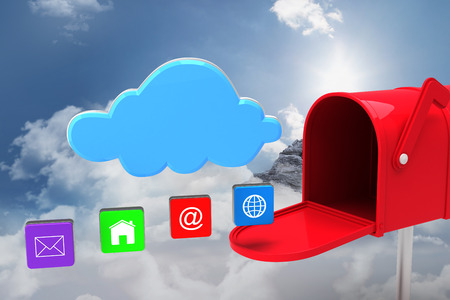 Red email postbox against mountain peak through the cloudsの写真素材