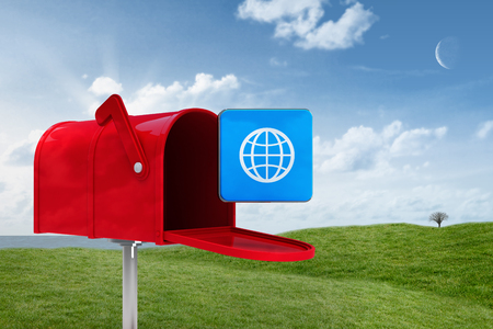 Red email postbox against field and skyの写真素材