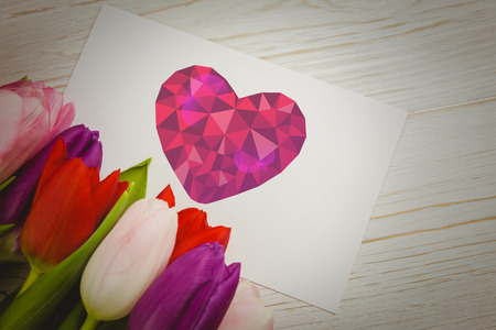 heart against tulips with cardの写真素材