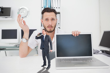 Businessman looking through binoculars against confused computer engineer looking at camera with...