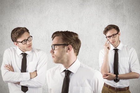 Thinking nerd against white and grey backgroundの写真素材