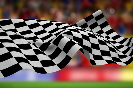 Checkered flag against blurry football pitch with crowdの写真素材