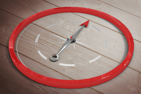 Compass against wooden floorの写真素材