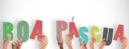 Hands holding up boa pasqua against white background with vignetteの写真素材