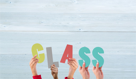 Hands holding up class against bleached wooden planks backgroundの写真素材