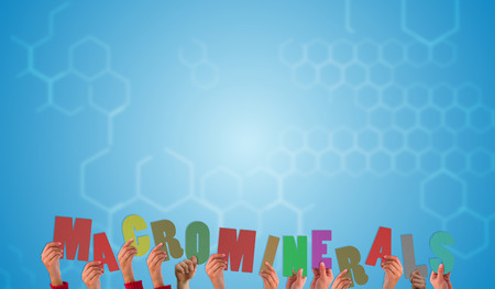 Hands holding up macrominerals  against chemical structure in blue and white
