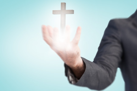 Businessman presenting with his hands against blue vignette backgroundの写真素材