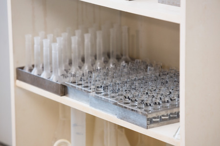 Tray with test tubes at the shelf in laboratory