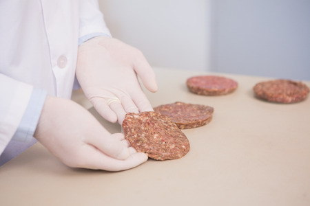 Scientist examining beefsteak in the laboratoryの写真素材