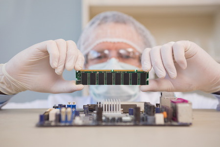 Engineer working on broken cpu in the laboratoryの写真素材