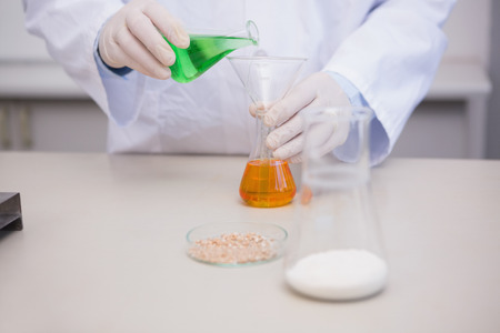 Scientist mixing precipitates in the laboratory