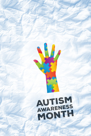 Autism awareness month against crumpled white pageの写真素材