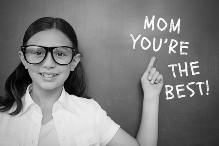 Schoolchild with blackboard against mothers day greeting