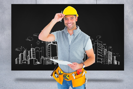 Portrait of smiling manual worker holding clipboard against composite image of black card
