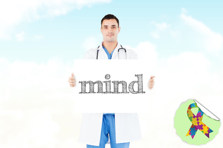 The word mind and portrait of a doctor holding a blank panel against blue skyの写真素材