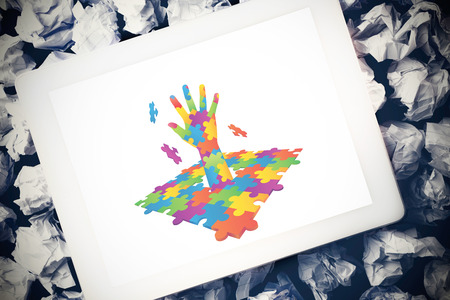 Autism awareness hand against tablet pcの写真素材