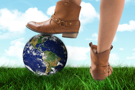 Cowboy boots dancing against blue skyの写真素材