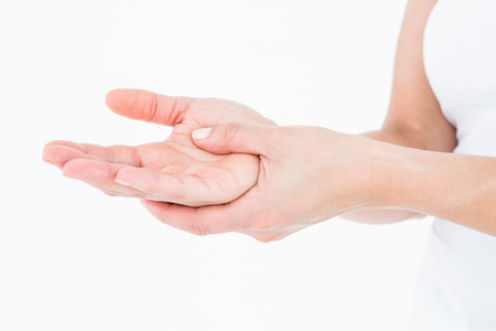 Woman with hand pain on white background