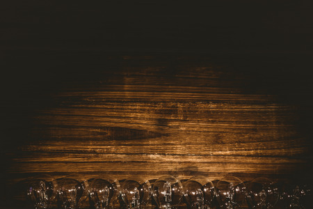 Row of light bulb on wooden table