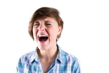 Pretty brunette shouting on white background