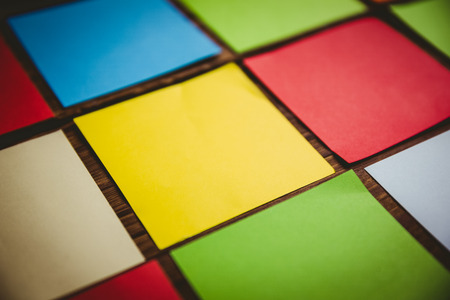 Colorful sticky post its on wooden backgroundの写真素材
